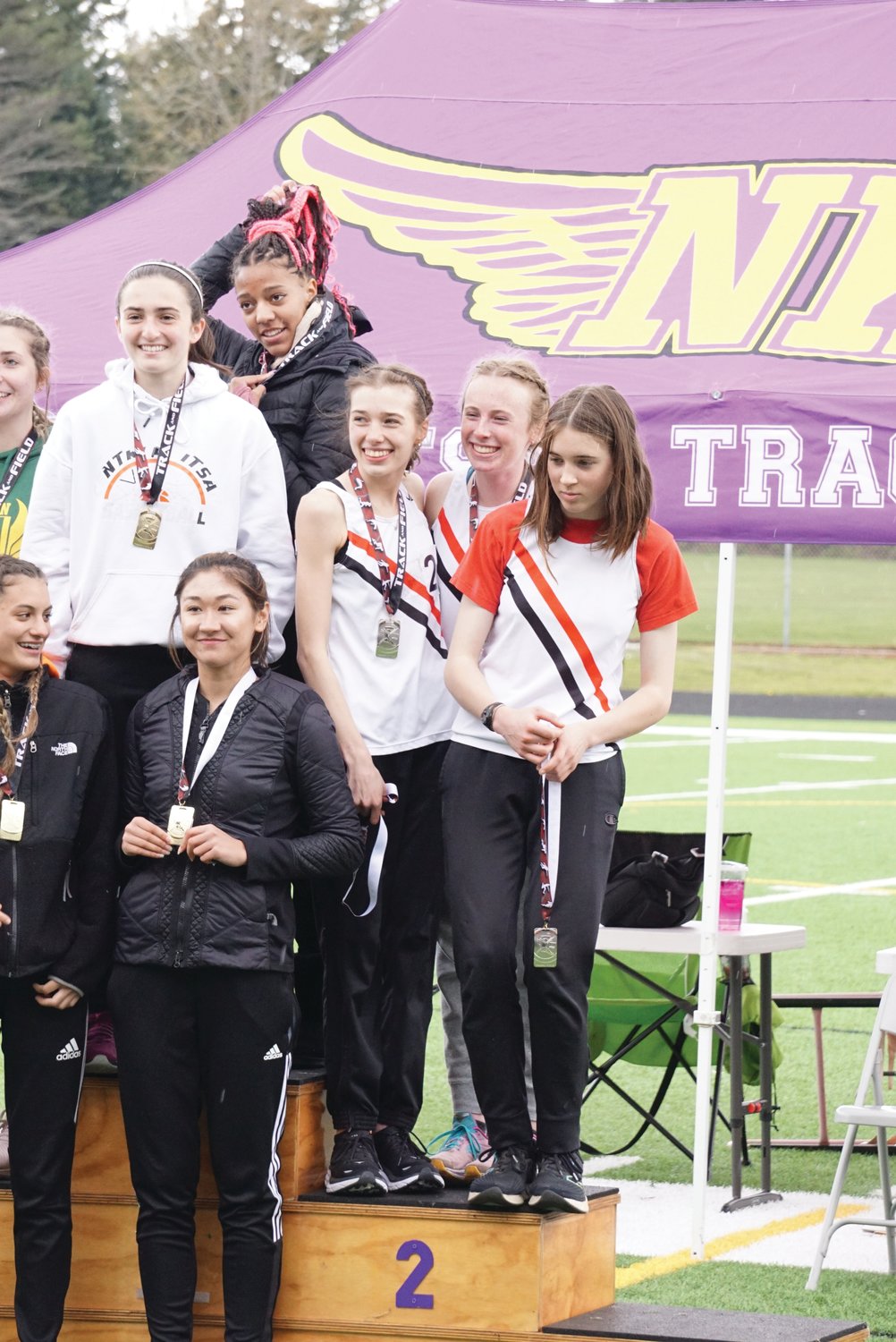 Members of the Rivals girls medley relay team (minus Lia Poore) pose during the awards ceremony at the Li’l Norway Invitational track event in Kitsap County.